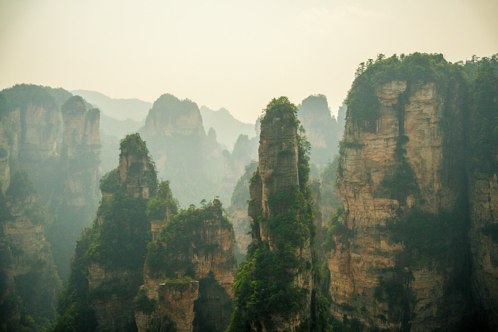 Jagged mountains rise out of the mist.